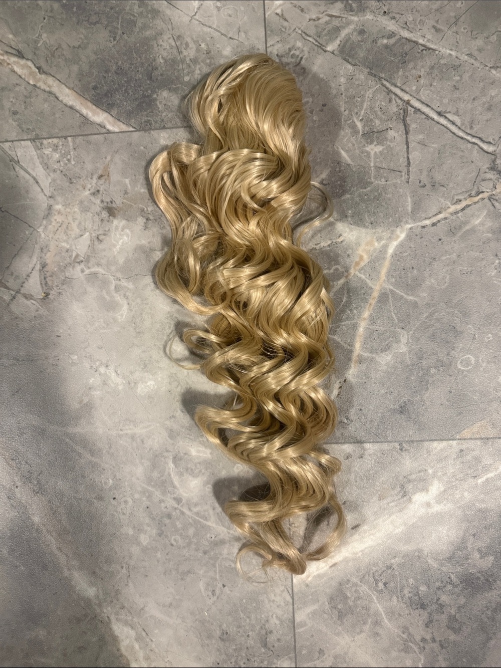 2/$45. 22” Synthetic Blonde Wavy Clip-In Ponytail Extension